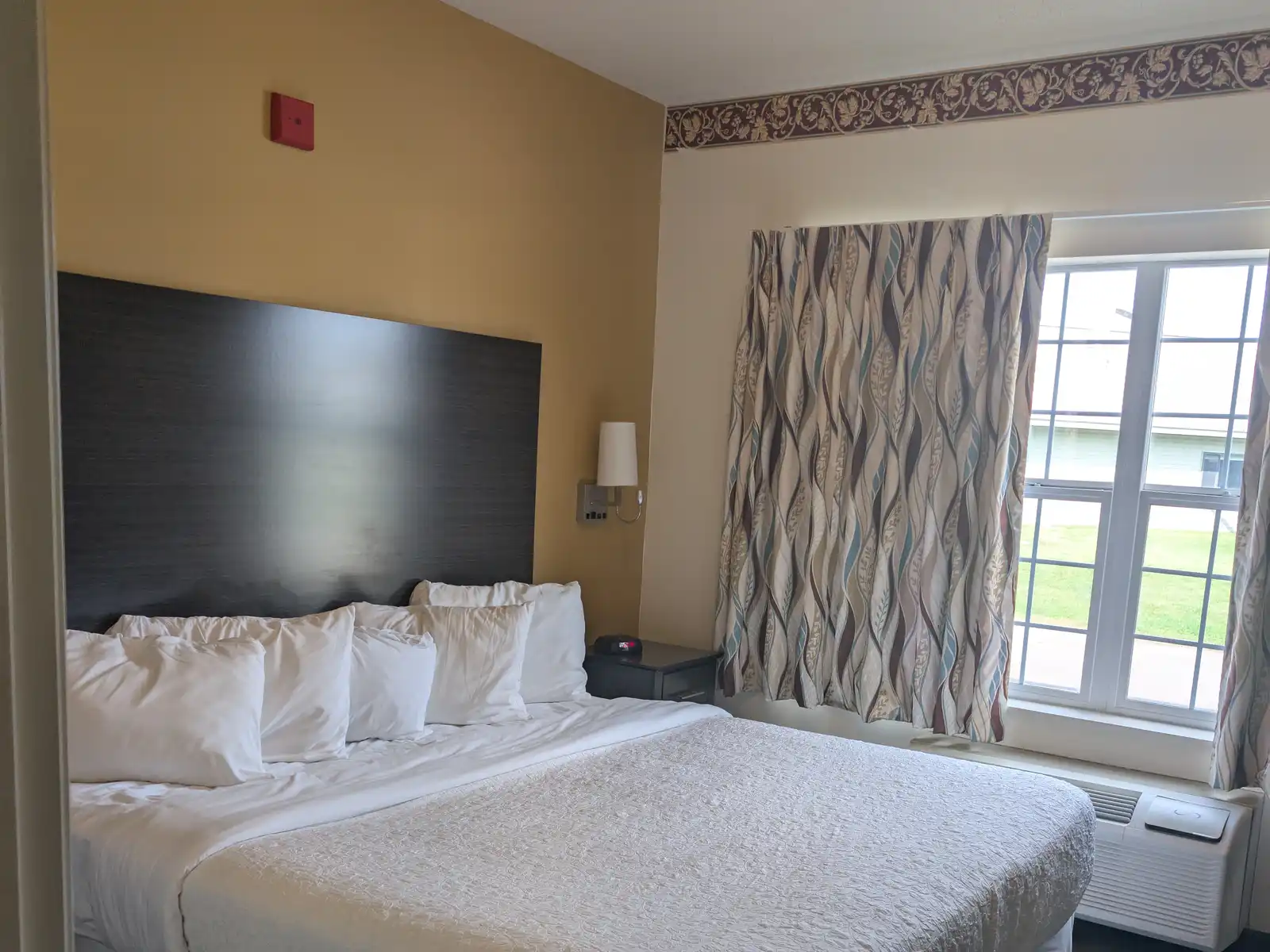 A King Single room at Chisholm Inn & Suites with one king bed
